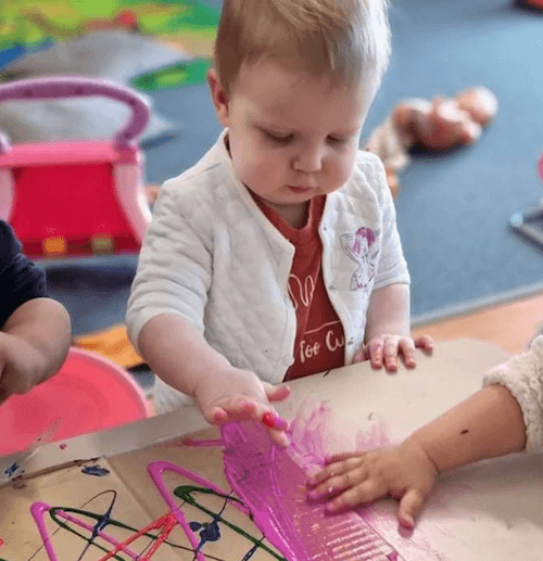 Kids enjoying messy play at day care