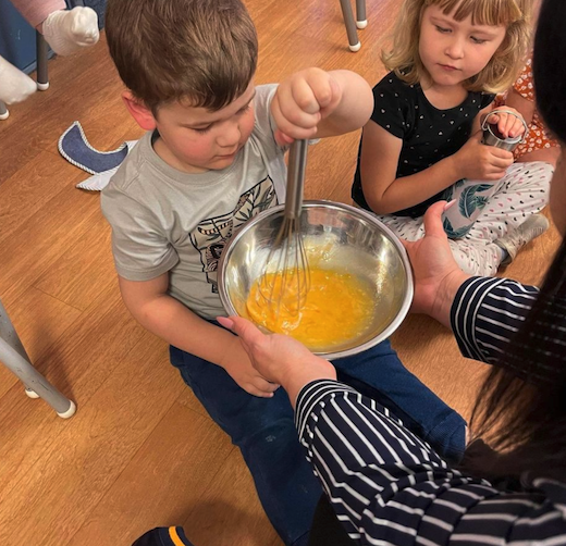 Children learning to cook at day care